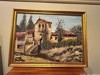 Framed oil painting on shelf showing full artwork and frame