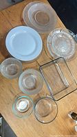 Overview of assorted glass and ceramic dishes on table