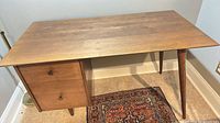 Full view of desk showing drawers and legs