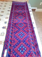 Full view of entire carpet runner laid flat on surface