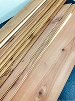 Stack of cedar planks showing tongue and groove edges