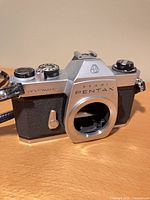 Front angled view of Asahi Pentax Spotmatic camera body with strap attached