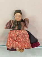 Full view of doll front, showing clothing and size