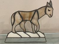 Front view of stained glass horse on base