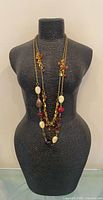 Front view of necklace on mannequin showing full length and bead arrangement