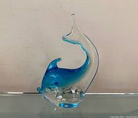 Front view of clear and blue Murano glass fish figurine