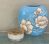 Trinket box and front view of blue floral vase