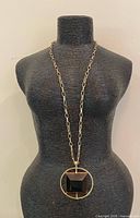 Full necklace on display bust showing length and pendant style