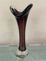 Full view of amethyst cased trumpet vase standing upright
