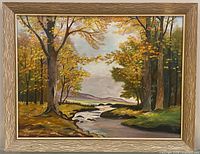 Front view of framed landscape oil painting with signature visible