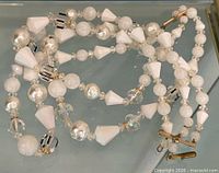 Entire necklace coiled showing bead variety and clasp