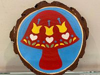 Front view showing full circular painted wood slab