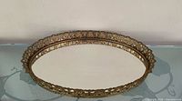 Full top view of oval filigree mirror tray