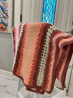 Blanket draped over chair showing overall color palette and texture