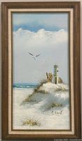 Full view of framed lighthouse seascape painting