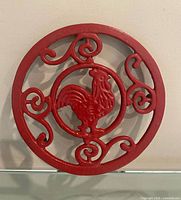 front view of red rooster trivet