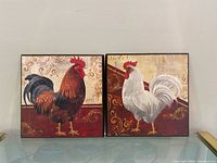 Front view of both rooster prints side by side