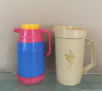 Front view of pitcher and thermos side by side