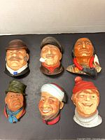Front view of all six Bossons chalkware heads