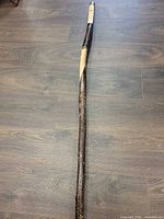 Full length of wooden walking stick