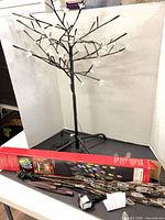 Full view of assembled LED branch tree with packaging and second set components