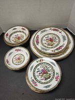 Stacked plates and bowls showing full 20-piece set