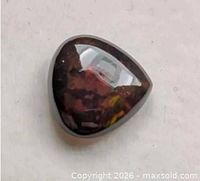 Pear cabochon black opal top view