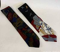 Both Beatles ties laid flat, full length view