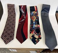 Front view of four neckties laid out