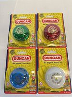 Front view of all four blister-carded yo-yos showing colors and packaging
