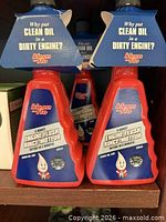 Front view of two Kleen-Flo Engine Flush bottles showing labels