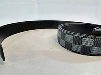 Belt laid flat showing check pattern and inner lining