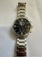 Front view of watch showing dial, chronograph subdials, bracelet