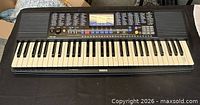 Top view of entire Yamaha PSR-190 keyboard showing keys, control panel and attached power cord