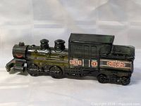 Full side view of glass train bottle