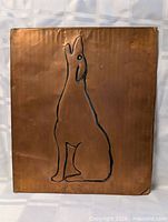Front view of copper wall art showing full wolf design