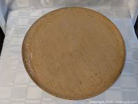 Top view of full round wooden board showing size and patina