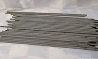 Stack of welding rods showing overall quantity and condition