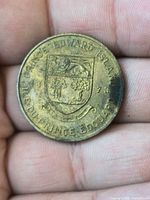 Obverse showing shield crest and dated 1873