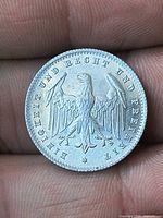Reverse eagle with motto