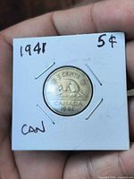 Front view in holder displaying beaver reverse and dated 1941