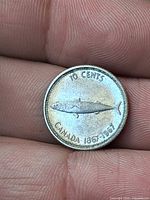 Reverse of 1967 Canadian dime showing fish design and legends