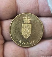 Obverse with Canadian coat of arms and CANADA inscription