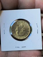 Obverse of Italy 200 Lire coin in 2×2 holder