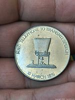 Reverse side showing telephone image and inscription