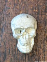 Front view of pewter skull ingot