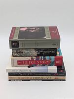 Stack of the seven books showing spines