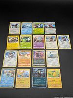 Full spread showing 18 Pokemon cards laid out