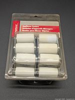 Front view of sealed package showing all four casters