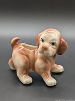 Full view of ceramic puppy dog planter showing overall form and coloring